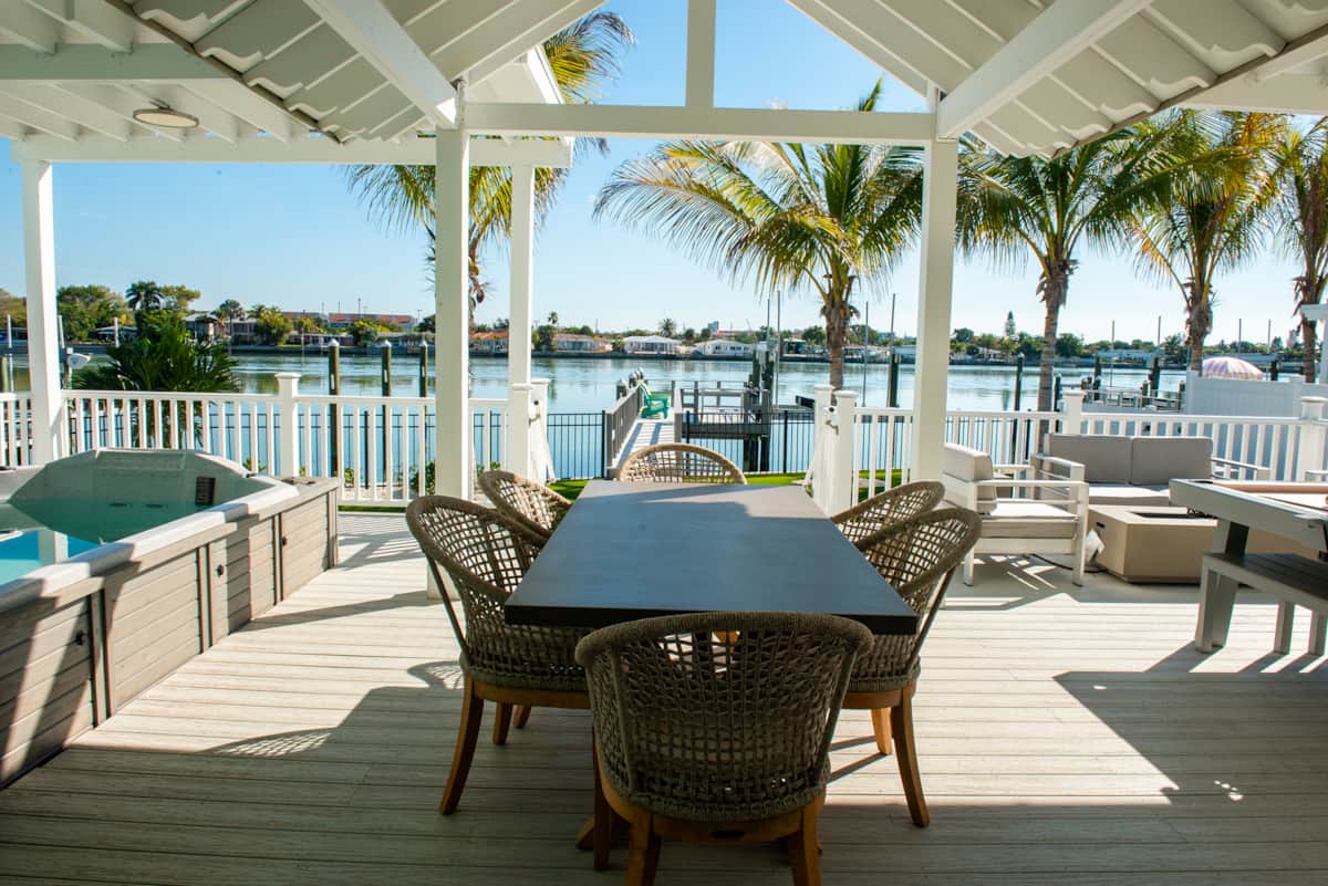 Outdoor dining, with spa to the left and pool table to the right. Relaxation all around.